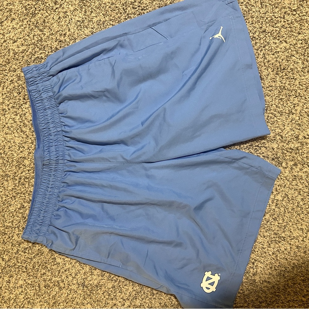 UNC football team issued performance shorts.  Higher slit vents up sides.